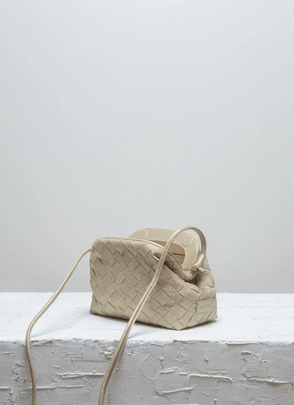 Calajade Aimee Sparkling Gold clutch gull flettet