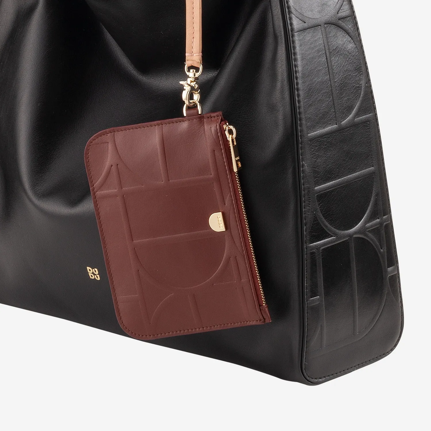DuDubags Estoril clutch i skinn svart nude håndleddsreim